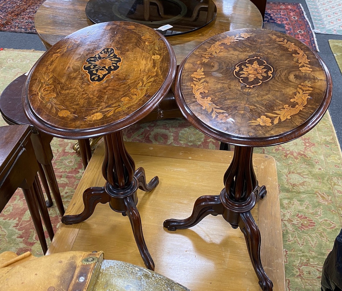 A near pair of Victorian marquetry inlaid oval walnut tripod wine tables with open baluster stems, larger width 61cm, depth 42cm, height 72cm